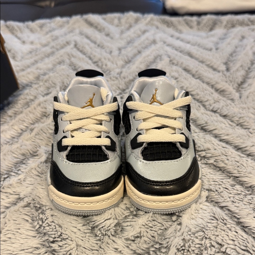 Nike Jordan 4s. White and a light metallic blue: never worn.